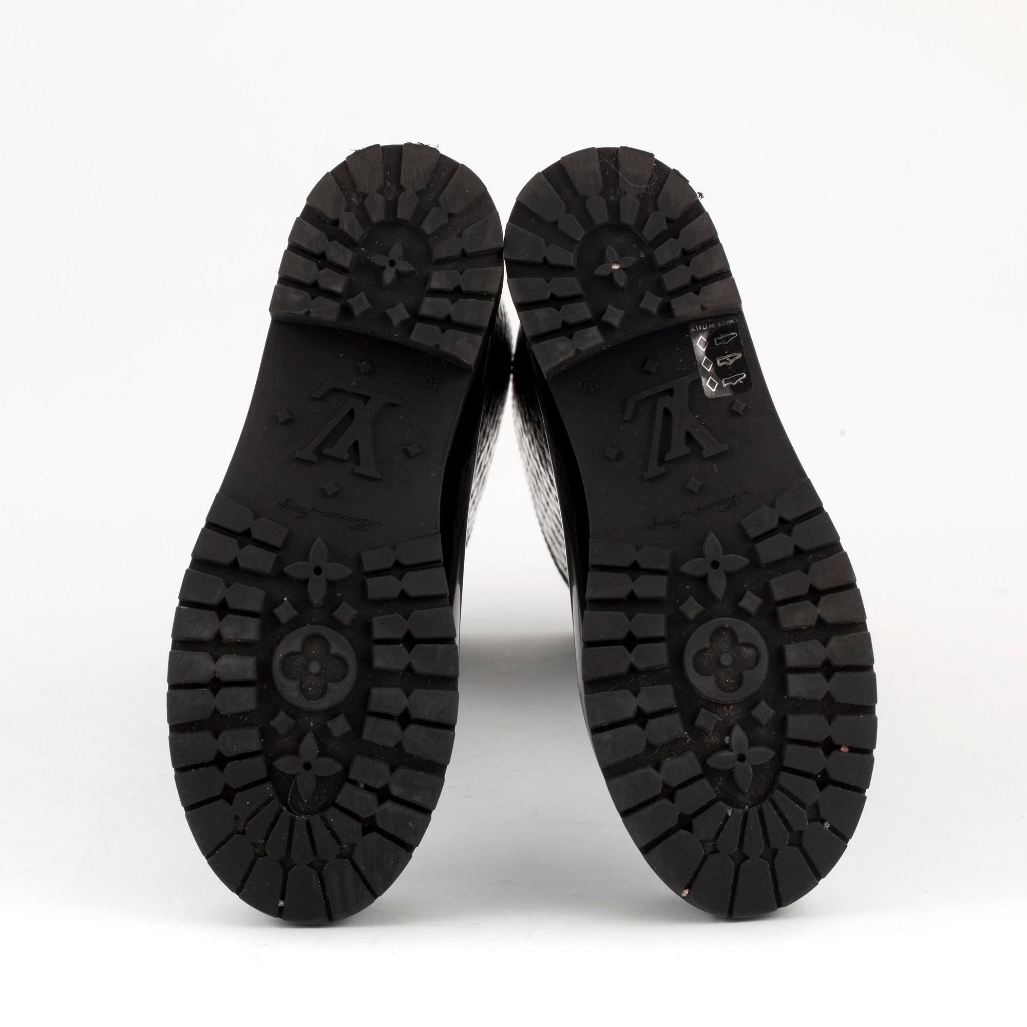 LOUIS VUITTON, a pair of rain boots. Size 36.