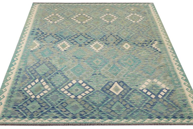 An Afghan kilim carpet, c. 299 x 213 cm.