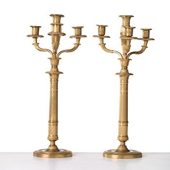 A pair of French Empire early 19th century four-light candelabra.