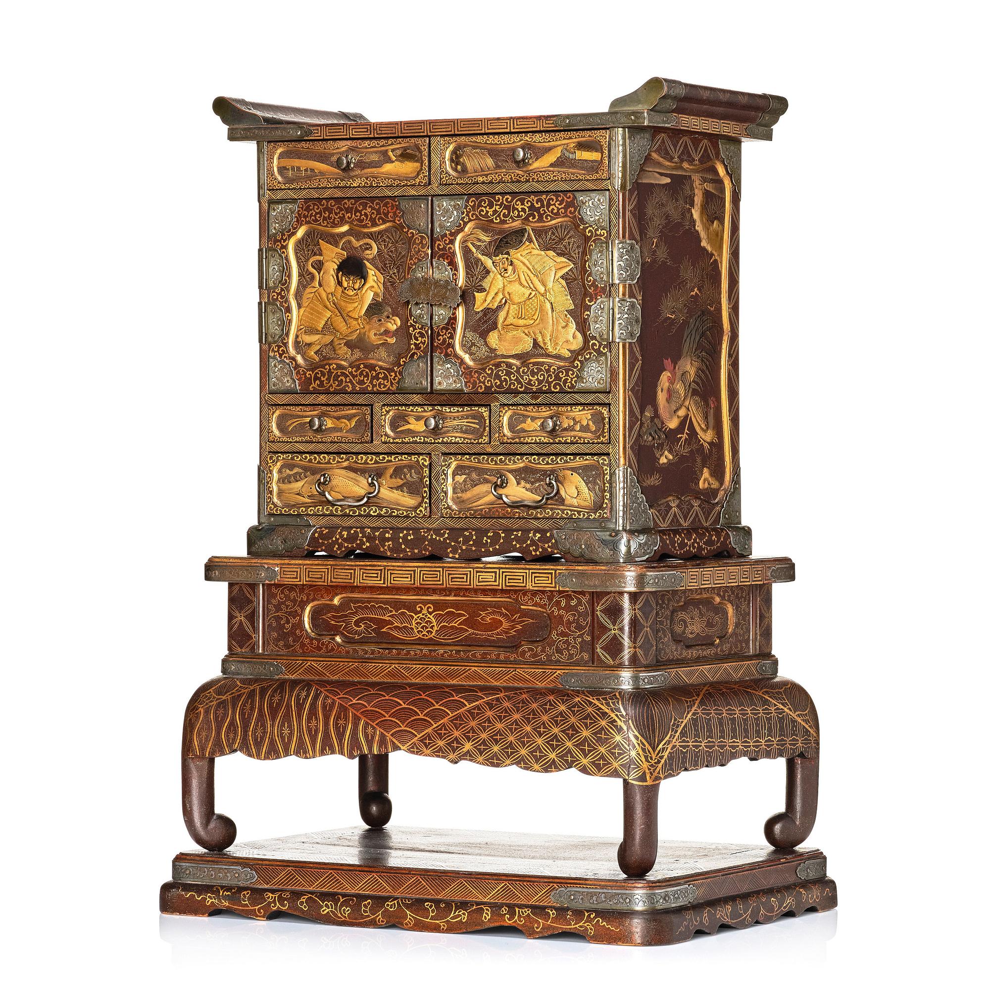 A Japanese lacquer cabinet on a stand, Meiji period (1868-1912).