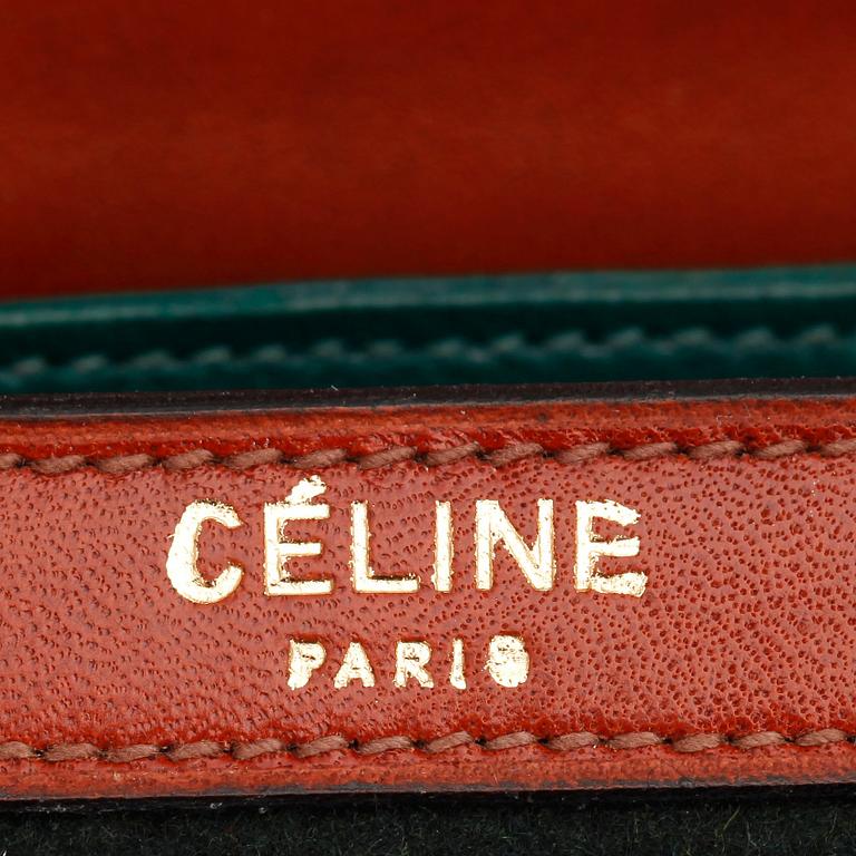 CÉLINE, a dark green felt and brown leather shoulder bag.