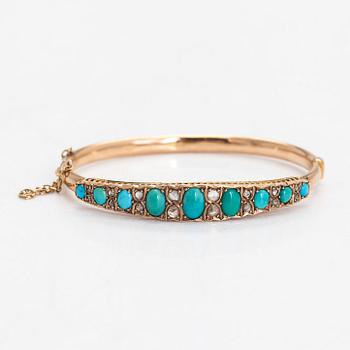 An approximately 9-11K gold bangle, with turquoises and rose-cut diamonds.