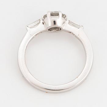 A 14K gold ring set with a round brilliant-cut diamond.