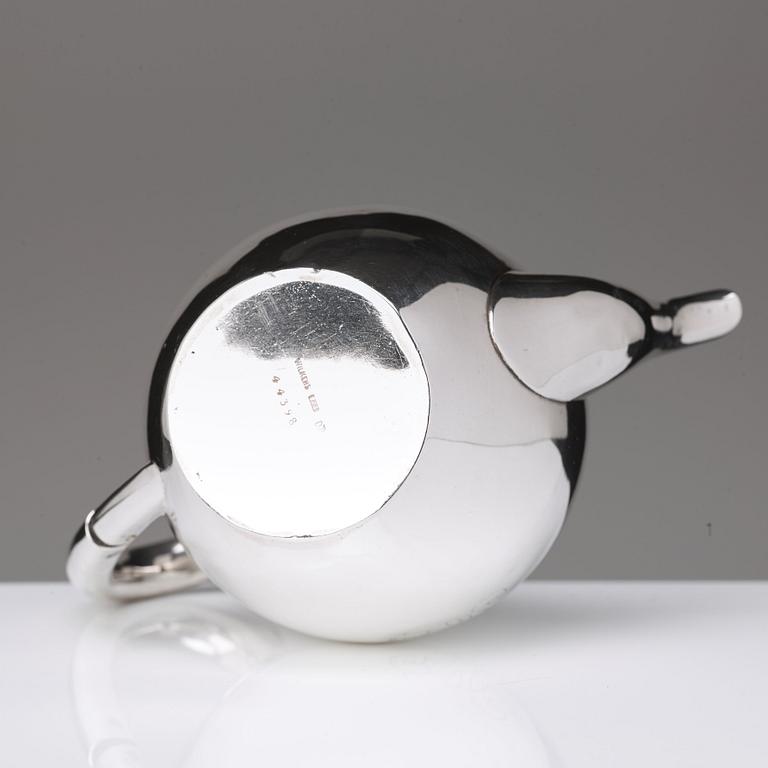 A German 20th century parcel-gilt silver tea-pot, marked Wilkens 875.