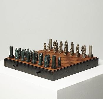 A set of 32 Tore Strindberg chess pieces, executed by Herman Bergman foundry, Stockholm.