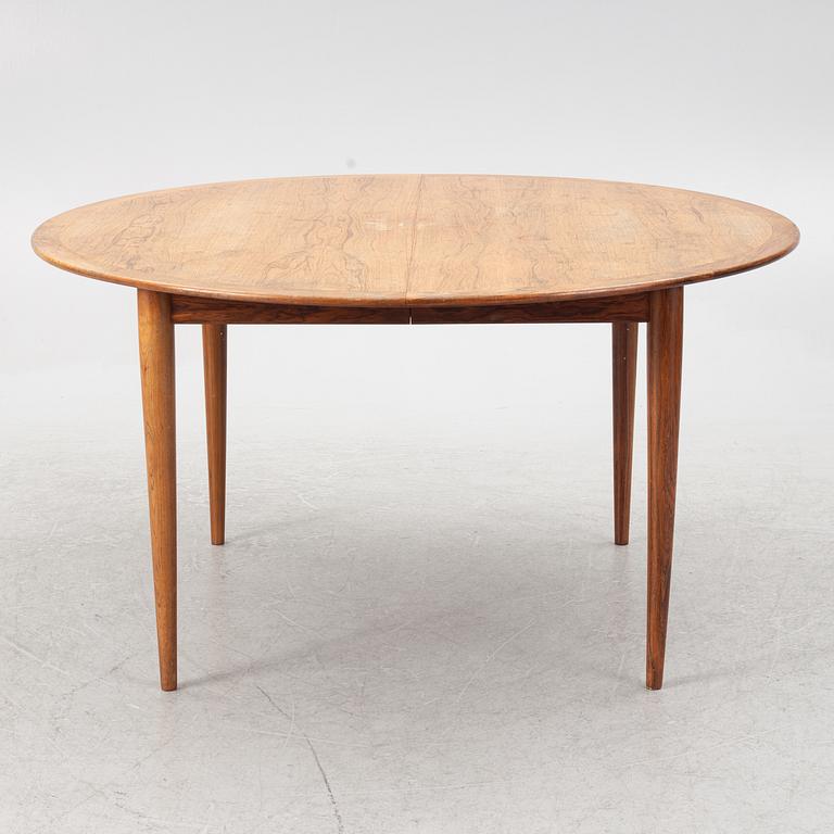Niels Otto Møller, a rosewood dining table and eight rosewood chairs, Poul Jeppesen & JL Möller, Denmark, 1960's.