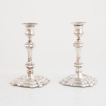 A pair of silver candlesticks, makr of William Hutton & Sons Ltd, London, 1900.