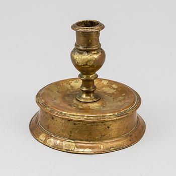 A 17th century bronze candlestick.