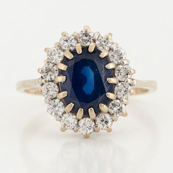 A sapphire and brilliant-cut diamond ring.