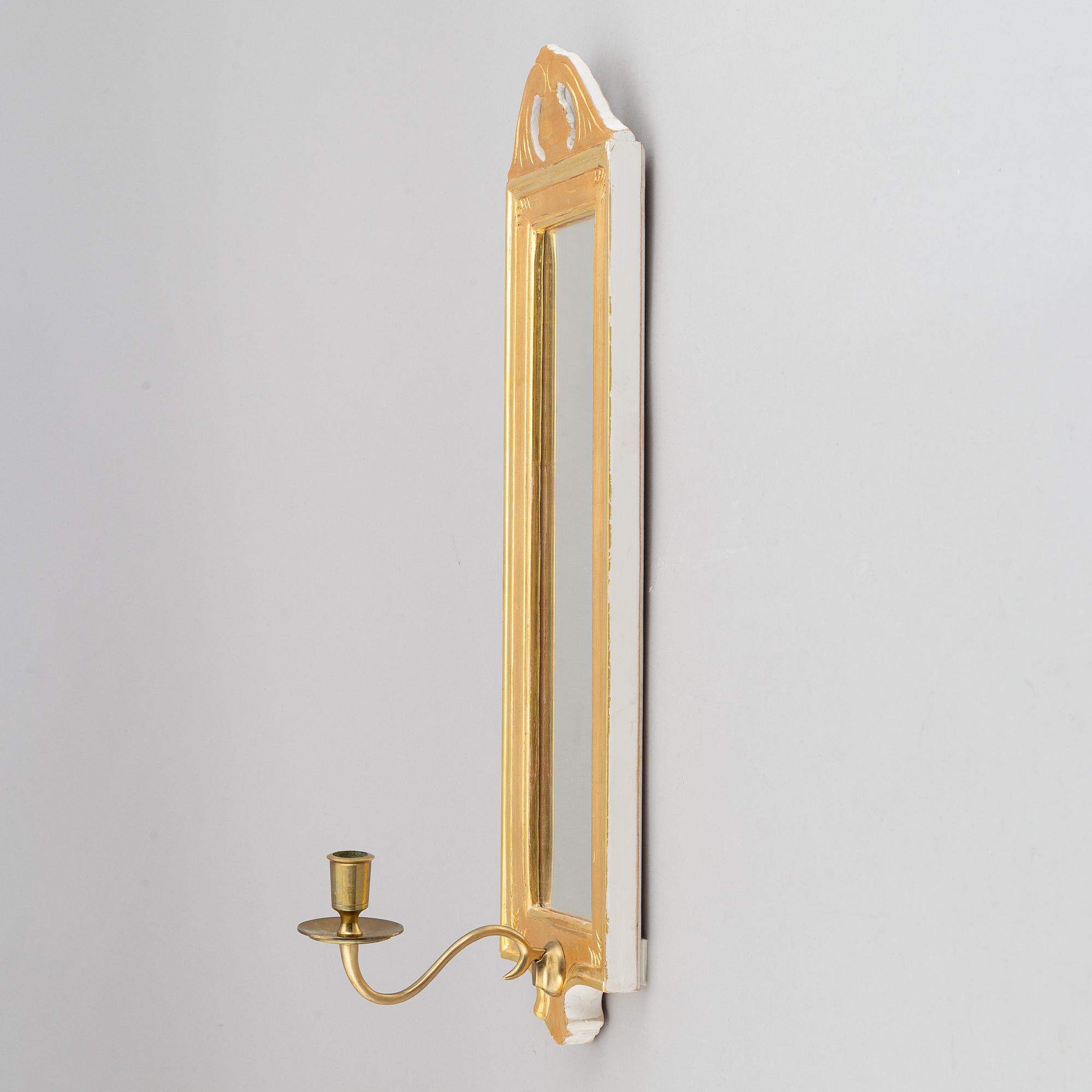 A 'Regnaholm' Gustavian style mirror sconce from Ikea, 1990.