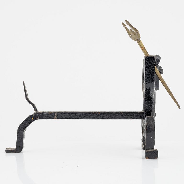 A cast iron fire dog by Eskil Björklund, second half of the 20th century.