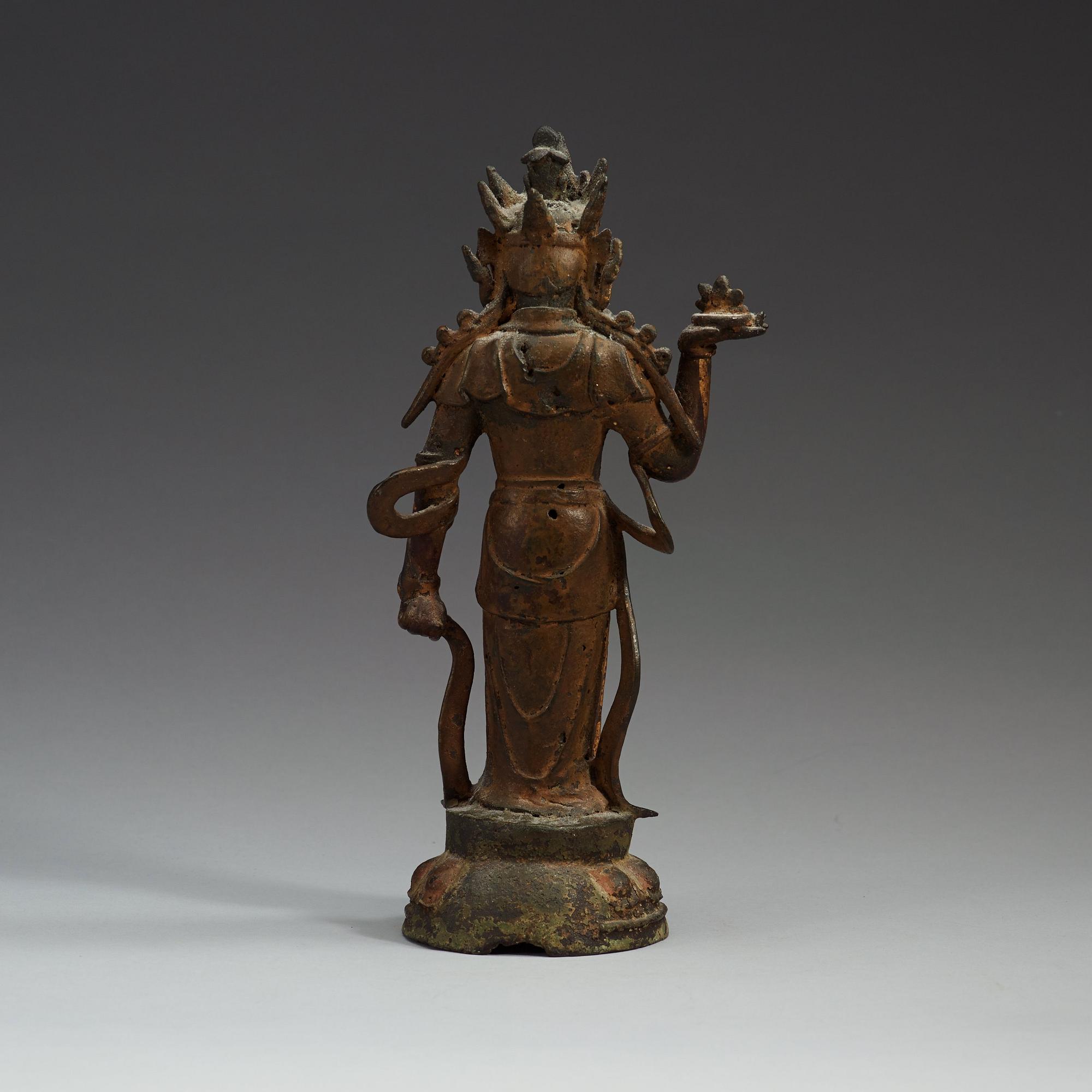 A gilt bronze figure of a standing Maitreya Bodhisattva, Ming dynasty (1368-1644).