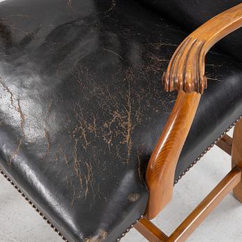A leather upholstered armchair, 20th Century.
