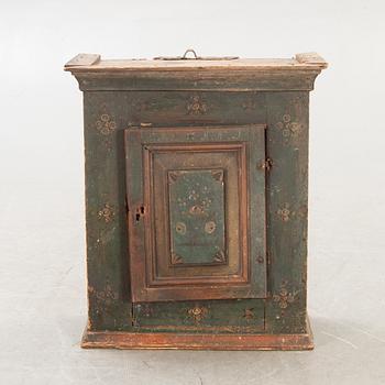 A Swedish painted wall cabinet around 1800.