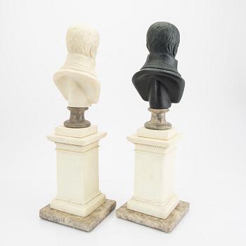 A pair of modern plaster statues of Napoleon.
