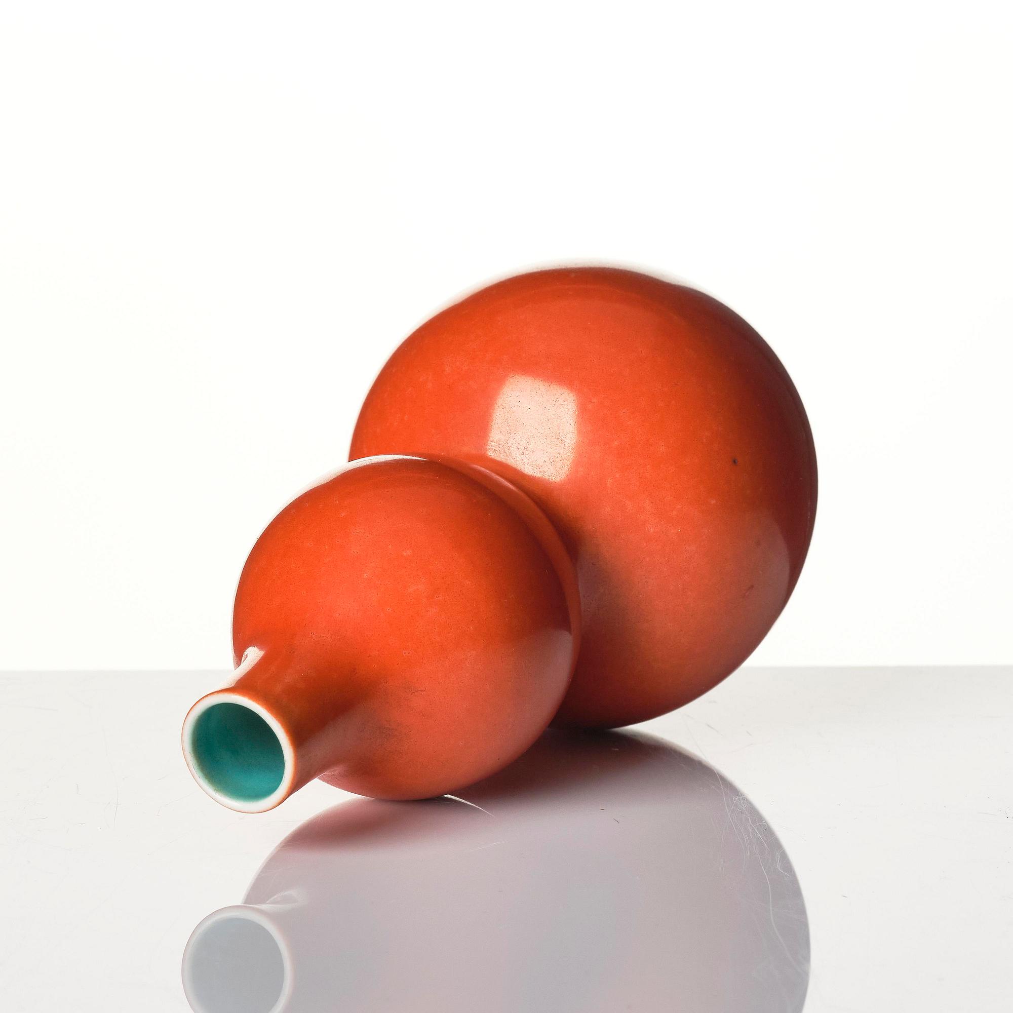 A coral red-enameled double-gourd vase, Qing dynasty with Jiaqing mark (1796-1820).