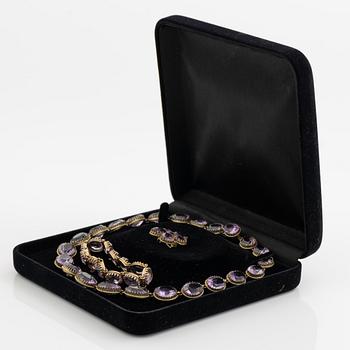 Garniture, necklace and bracelet silver with amethysts, brooch gold-coloured metal with purple paste stones,