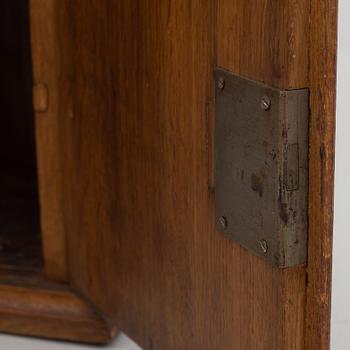 A wall cabinet, dated 1765.