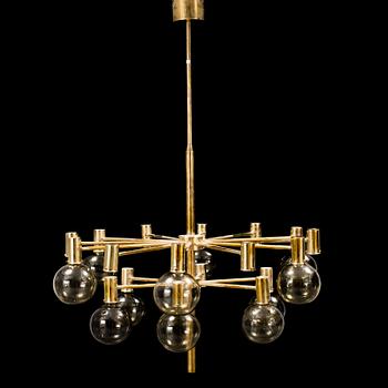 A 20th century brass and smoked glass chandelier by Hans Agne Jakobsson, Markaryd, Sweden.