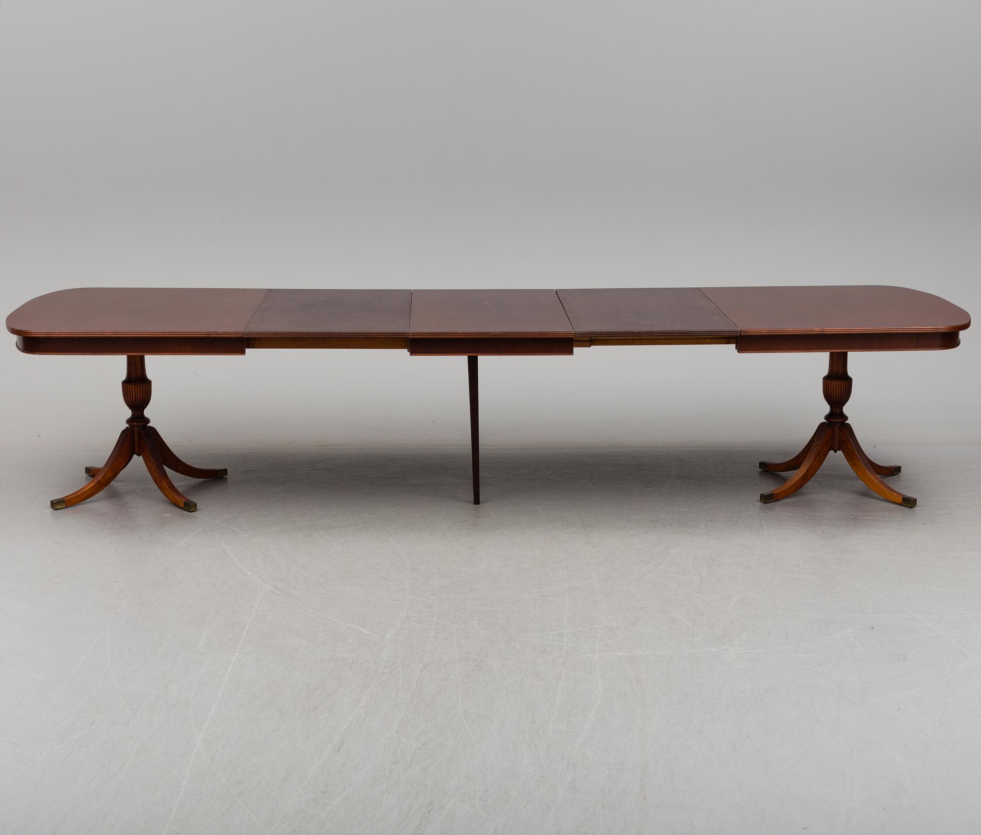 A dining table and 12 chairs, second half of the 20th century.