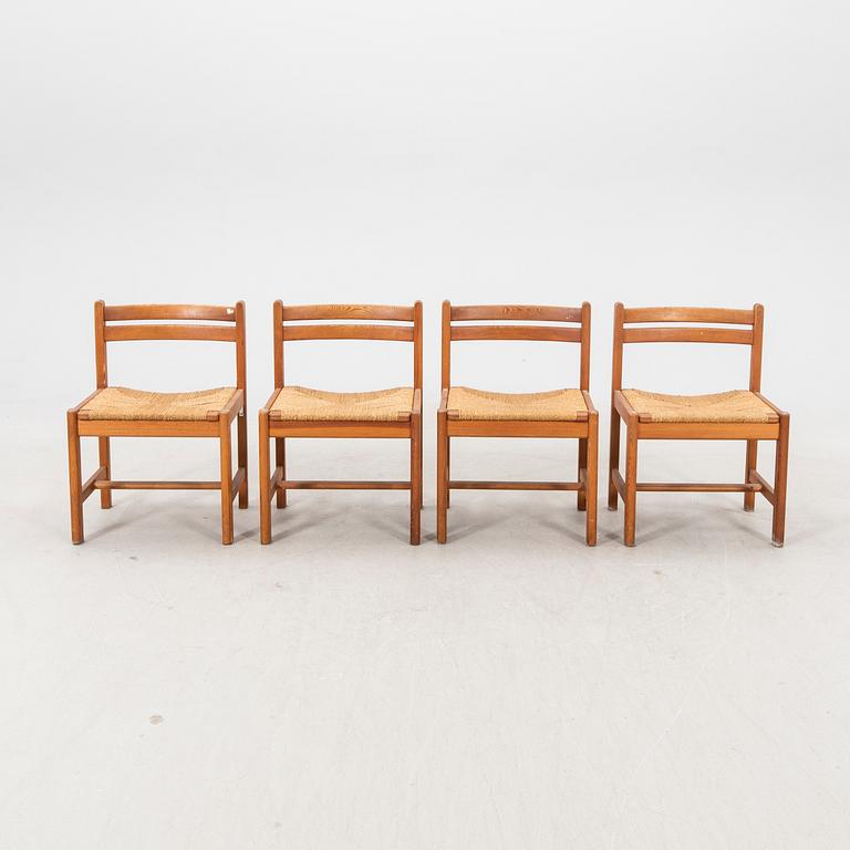 A set of four 1970s pine chairs.