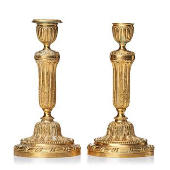 73. A pair of Louis XVI-style 20th century  candlesticks.