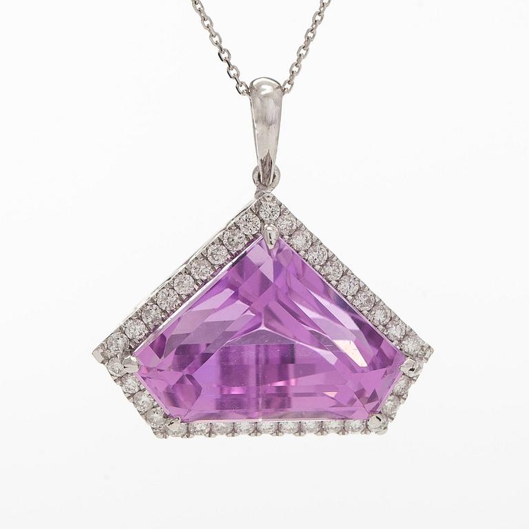 A 14K gold necklace with kunzite and brilliant cut diamonds.
