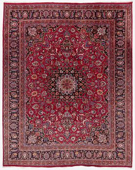 An Oriental carpet, approx. 380 x 304 cm.