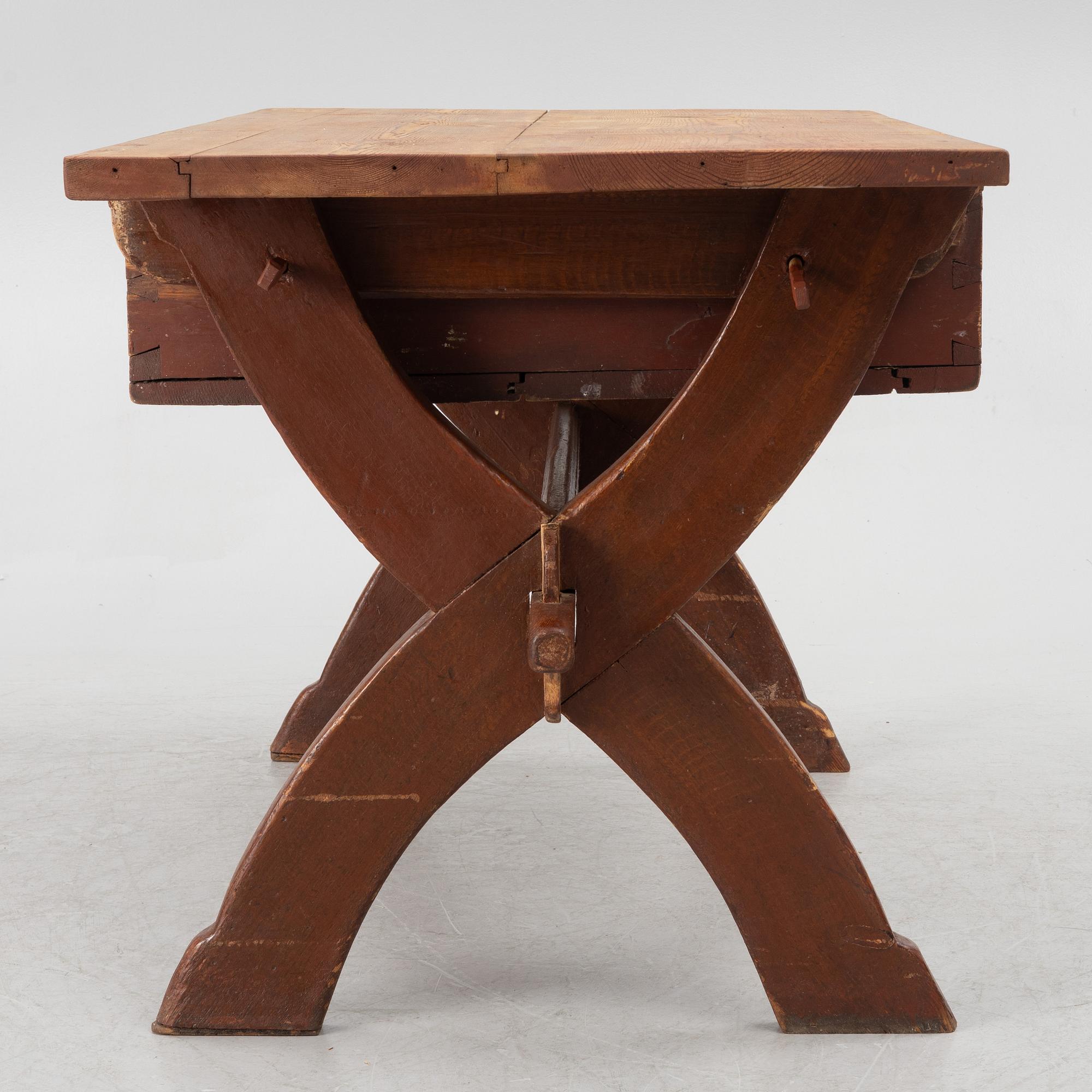 A Swedish folk-art trestle table from Dalarna, dated 1854.