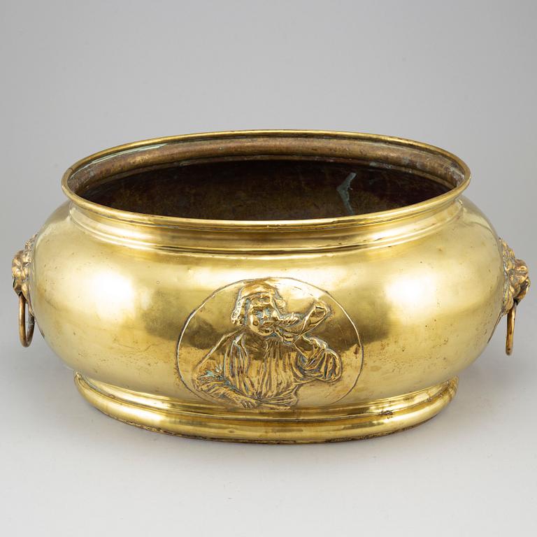 A 19th century brass champagne cooler.