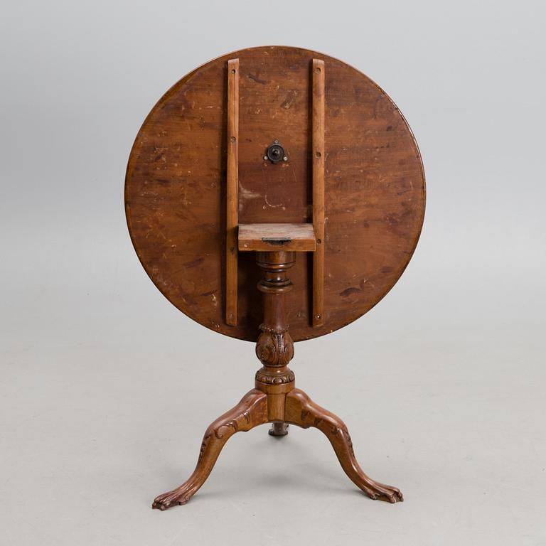A 18th century mahogany English tilt top table.