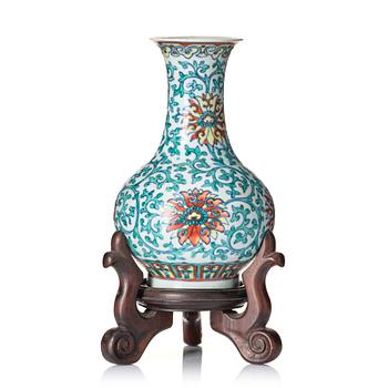 A doucai 'lotus' vase, Qing dynasty with Qianlong seal mark and of the period.