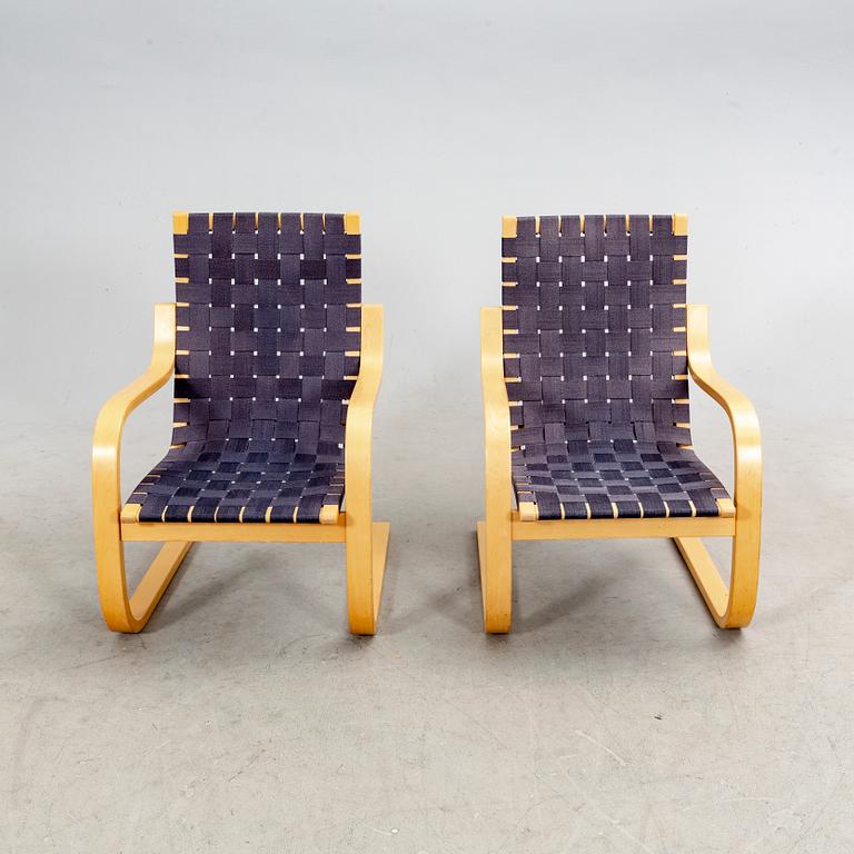 Alvar Aalto, a pair of birch armchairs model 406 21st century.