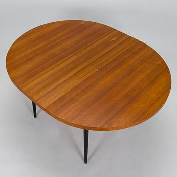 A mid-20th century dining table.