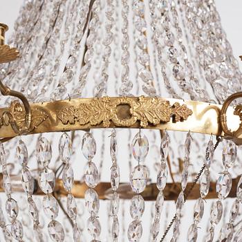 An Empire nine-light gilt-brass and cut-glass, Stockholm, early 19th century.