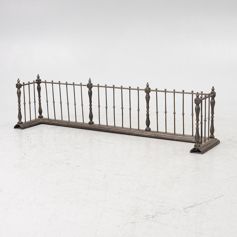 An English brass fire gate, circa 1800.