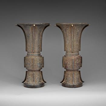 A pair of large archaistic shaped bronze Gu vases, Ming dynasty (1368-1644).