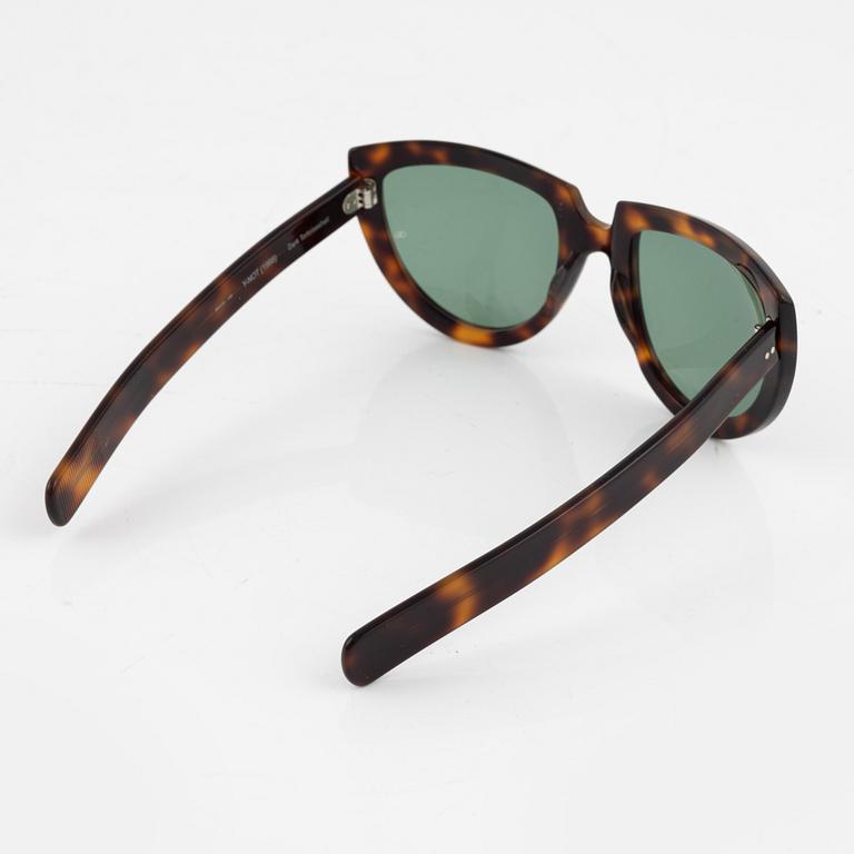 Oliver Goldsmith, a pair of  "Y-not" sunglasses.