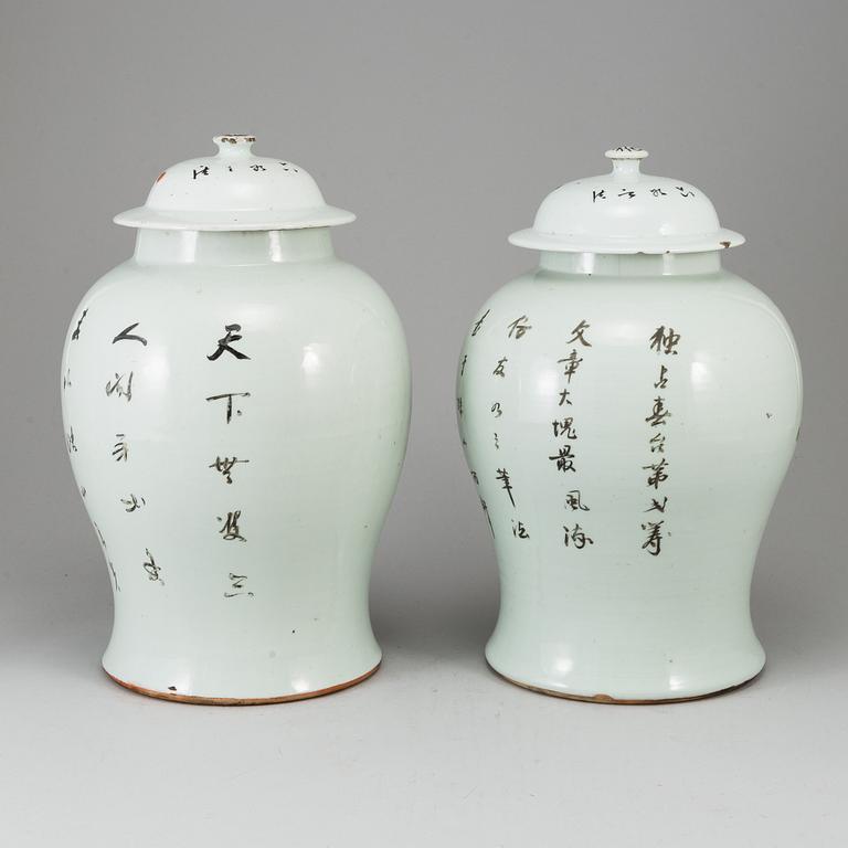 A pair of Chinese famille rose vases with covers, 20th century.