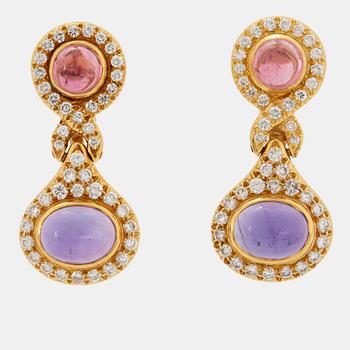 A pair of 18K gold Bulgari earrings set with cabochon-cut amethyst and tourmaline.