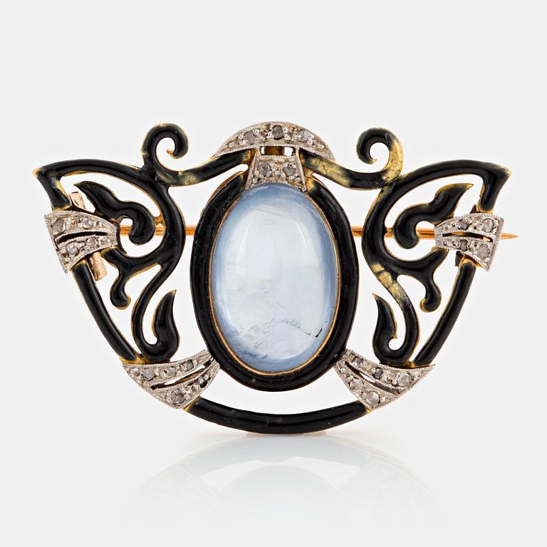 An 18K gold and platinum brooch set with a sapphire and rose-cut diamonds.