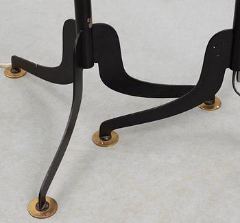 A pair of Josef Frank iron and brass floor lamps by Svenskt Tenn.