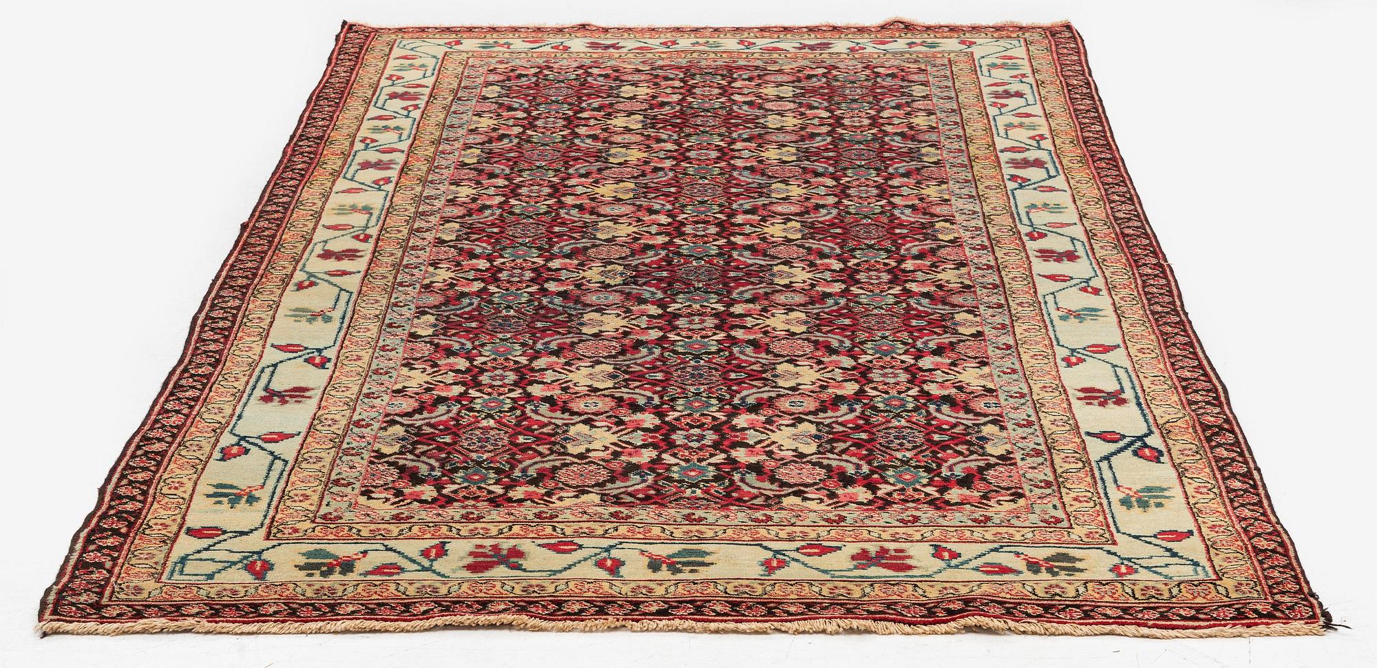 An antique Agra carpet, Northern India, c. 272 x 150 cm.