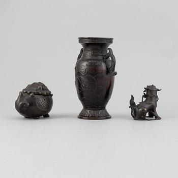 A Chinese bronze vase, figurine and censer, late Qing dynasty.