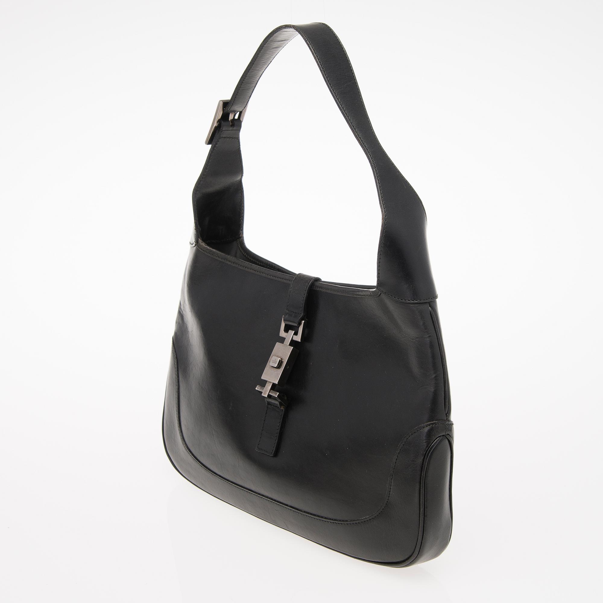 A Black Leather Jackie Bag.