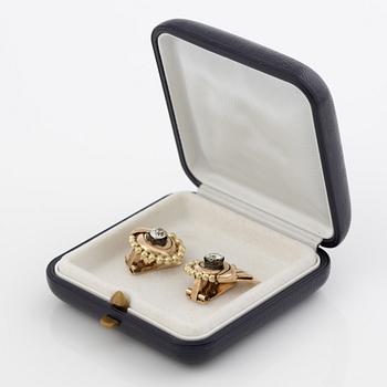 A pair of earrings in 14K gold set with old-cut diamonds.