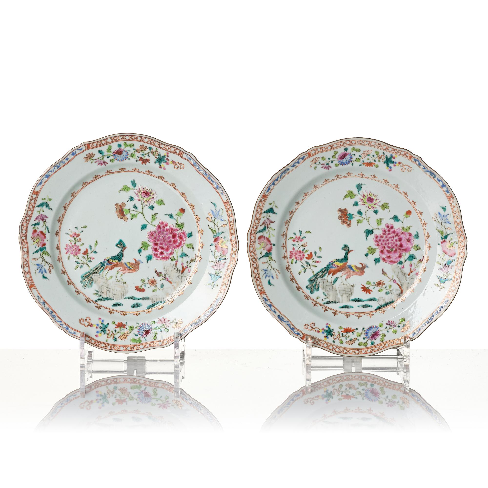 A pair of Chinese famille rose porcelain 'double peacock' plates, Qing dynasty, Qianlong (1736-95).