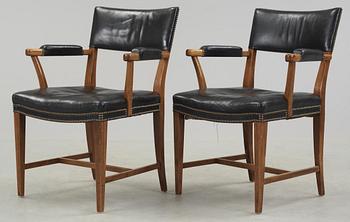 333. A pair of Josef Frank walnut and black leather armchairs, Svenskt Tenn, model 695.