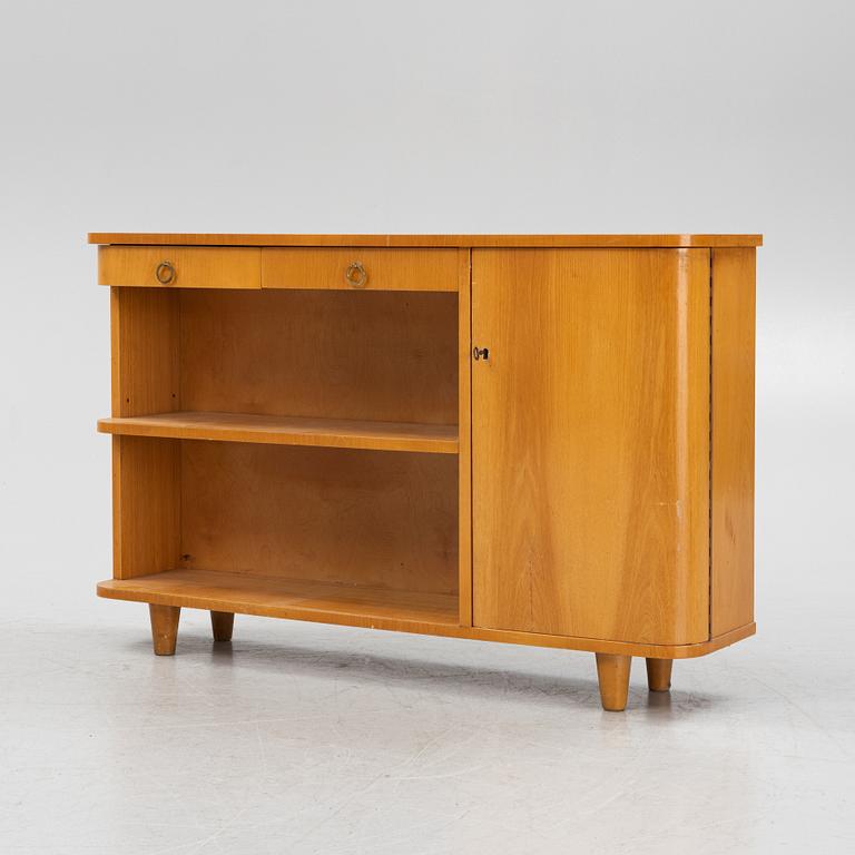An elm wood veneered book case with drawers and cabinet, mid 20th Century.