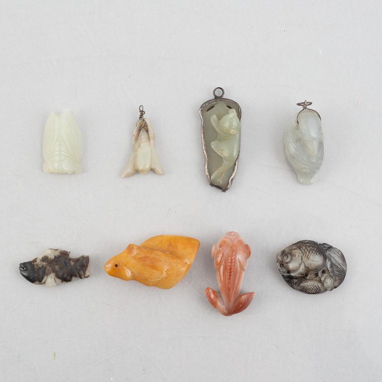 A group of eight Chinese stone charms / pendants, 20th century.